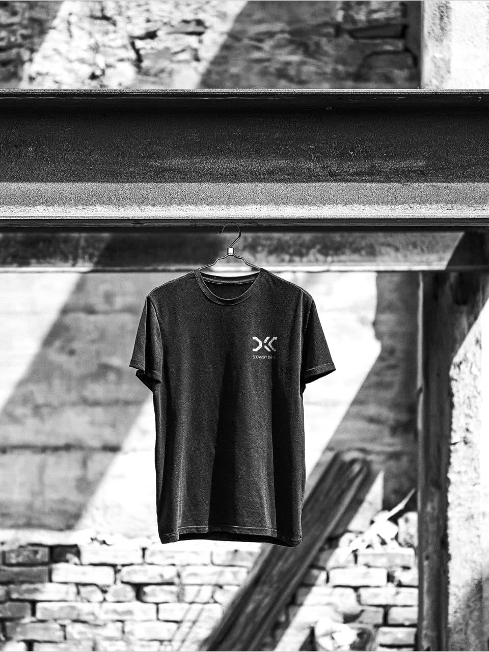 DKC Stavby Brno logo on a company t-shirt