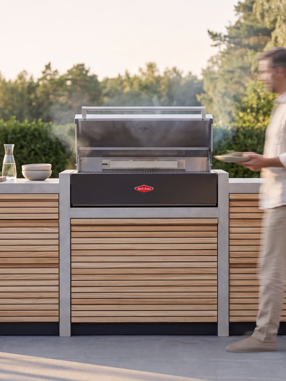 Lifestyle photo of a man beside the RA Beton grill